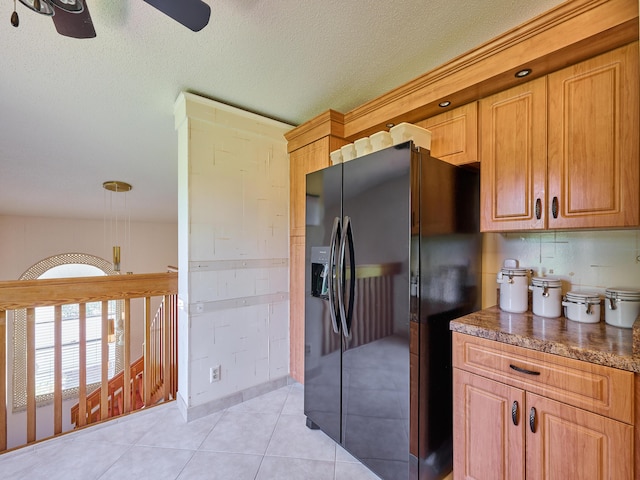 10828 Lake Palm Ln Unit 202, Boynton Beach, FL 33437 - kitchen with black fridge with ice dispenser, a ceiling fan, light tile patterned floors, a textured ceiling, and backsplash