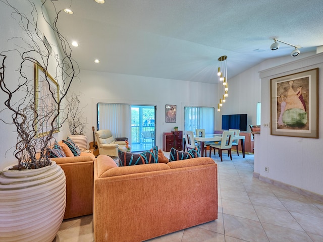 10828 Lake Palm Ln Unit 202, Boynton Beach, FL 33437 - living room featuring vaulted ceiling and light tile patterned floors