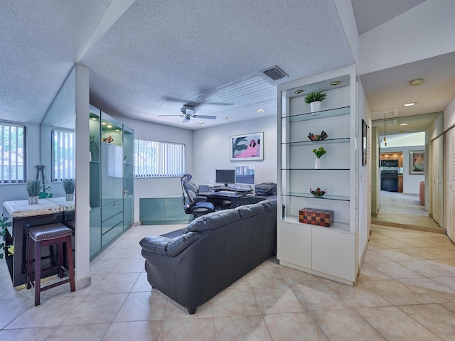 10828 Lake Palm Ln Unit 202, Boynton Beach, FL 33437 - living area featuring ceiling fan, a textured ceiling, an office area, and light tile patterned floors