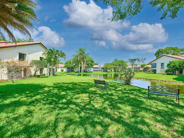 10828 Lake Palm Ln Unit 202, Boynton Beach, FL 33437 - view of green lawn featuring a water view