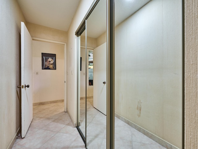 10828 Lake Palm Ln Unit 202, Boynton Beach, FL 33437 - hall featuring light tile patterned floors and baseboards