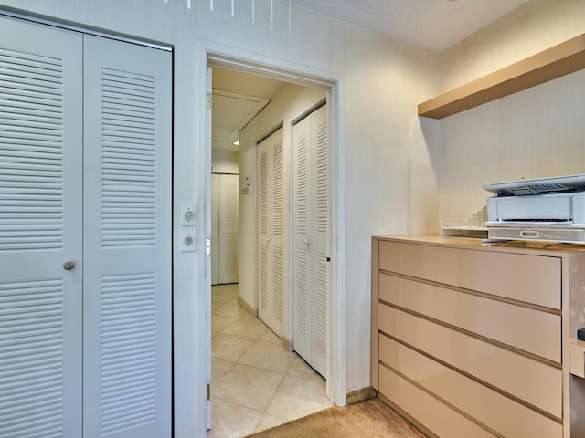 10828 Lake Palm Ln Unit 202, Boynton Beach, FL 33437 - hallway featuring attic access and light tile patterned floors