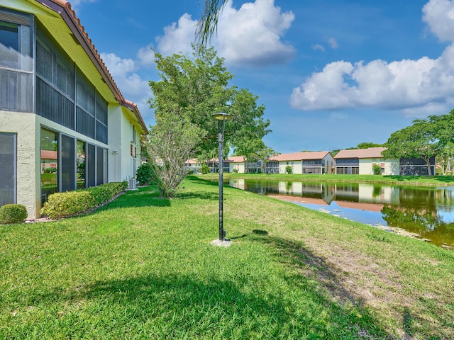 10828 Lake Palm Ln Unit 202, Boynton Beach, FL 33437 - view of grassy yard with a water view and a residential view
