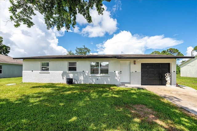 673 NE Horizon Ln, Port Saint Lucie, FL 34983 - ranch-style house with brick siding, an attached garage, concrete driveway, and a front yard
