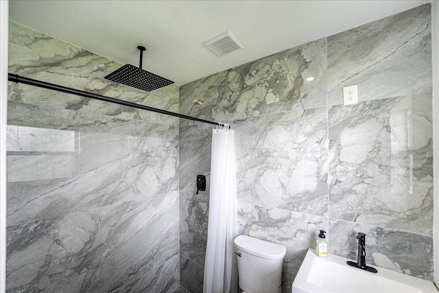 673 NE Horizon Ln, Port Saint Lucie, FL 34983 - bathroom with tiled shower and tile walls