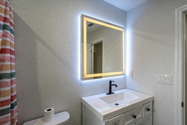 673 NE Horizon Ln, Port Saint Lucie, FL 34983 - bathroom featuring toilet and vanity