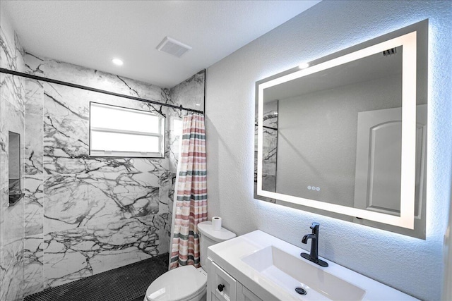 673 NE Horizon Ln, Port Saint Lucie, FL 34983 - full bathroom featuring a marble finish shower, vanity, and a textured wall