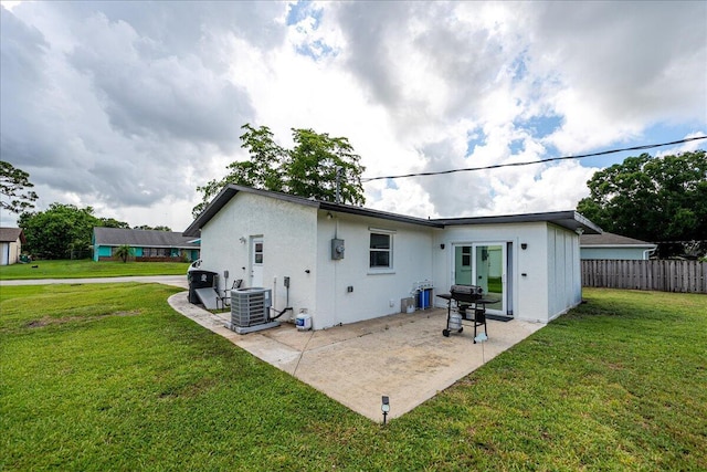 673 NE Horizon Ln, Port Saint Lucie, FL 34983 - back of house featuring a patio and stucco siding