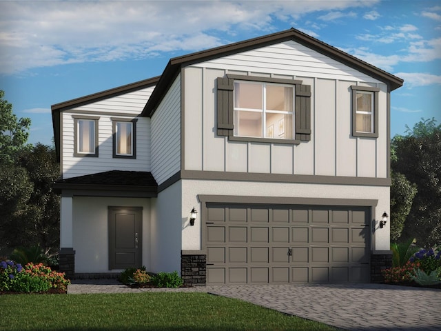 14328 SW Rain Rd, Indiantown, FL 34956 - view of front of property with a garage, driveway, stone siding, and board and batten siding