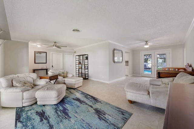 1546 35th Ave, Vero Beach, FL 32960 - living room featuring ceiling fan, a textured ceiling, crown molding, light tile patterned floors, and french doors