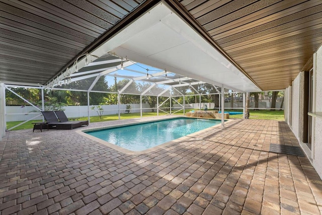 1546 35th Ave, Vero Beach, FL 32960 - view of swimming pool with a fenced backyard, a patio area, and glass enclosure