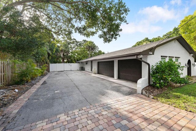 1546 35th Ave, Vero Beach, FL 32960 - garage with asphalt driveway