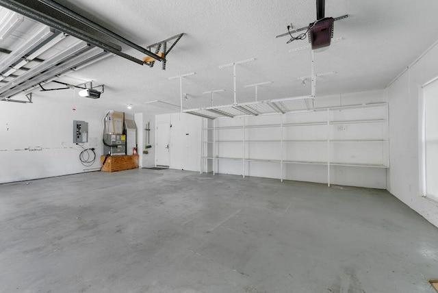 1546 35th Ave, Vero Beach, FL 32960 - garage featuring a garage door opener, electric panel, and heating unit