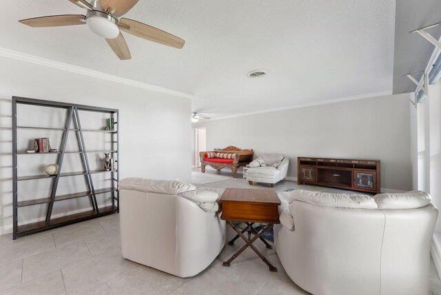 1546 35th Ave, Vero Beach, FL 32960 - living area with ornamental molding, ceiling fan, light tile patterned flooring, and a textured ceiling