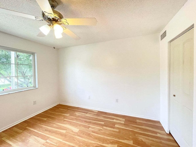 7832 Sonoma Springs Cir Unit 203, Lake Worth, FL 33463 - unfurnished bedroom with light wood finished floors, a textured ceiling, and a ceiling fan