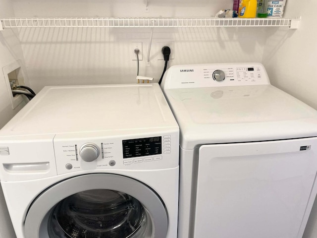 7832 Sonoma Springs Cir Unit 203, Lake Worth, FL 33463 - washroom with washer and clothes dryer
