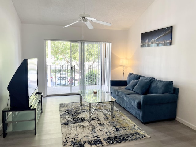 7832 Sonoma Springs Cir Unit 203, Lake Worth, FL 33463 - living area featuring a ceiling fan, a textured ceiling, and wood finished floors