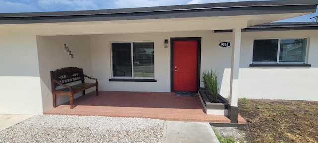9258 N Military Trl, Palm Beach Gardens, FL 33410 - entrance to property featuring stucco siding and a porch