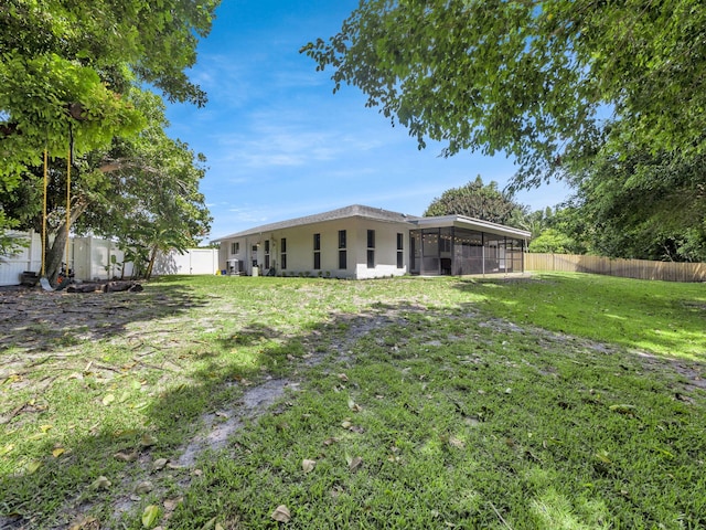 17516 Birchwood Dr, Boca Raton, FL 33487 - fenced backyard with a sunroom