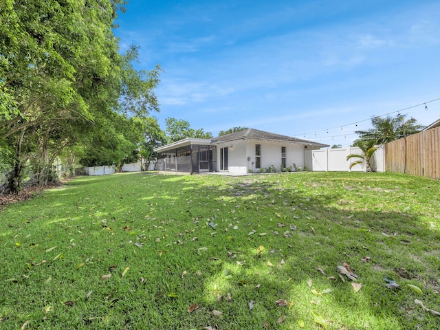 17516 Birchwood Dr, Boca Raton, FL 33487 - fenced backyard with a sunroom
