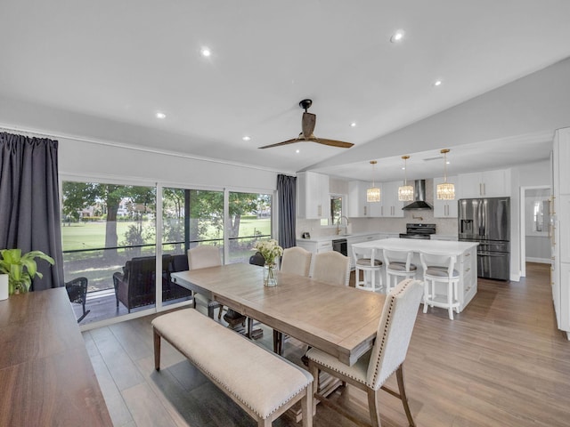 17516 Birchwood Dr, Boca Raton, FL 33487 - dining area featuring vaulted ceiling, light wood-style flooring, plenty of natural light, ceiling fan, and recessed lighting