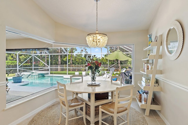 5885 SE Forest Glade Trl, Hobe Sound, FL 33455 - dining area featuring a sunroom and a chandelier