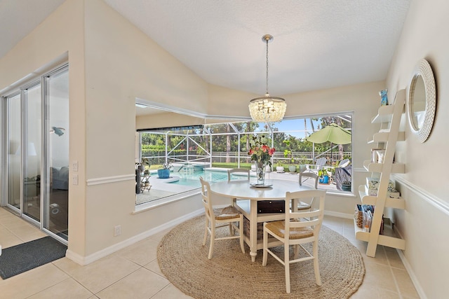 5885 SE Forest Glade Trl, Hobe Sound, FL 33455 - tiled dining room featuring healthy amount of natural light, a textured ceiling, vaulted ceiling, a sunroom, and a chandelier