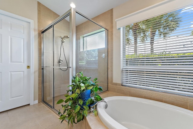 5885 SE Forest Glade Trl, Hobe Sound, FL 33455 - full bathroom featuring a garden tub, a stall shower, and tile patterned floors