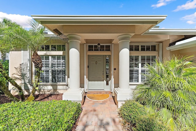 5885 SE Forest Glade Trl, Hobe Sound, FL 33455 - view of exterior entry with stucco siding