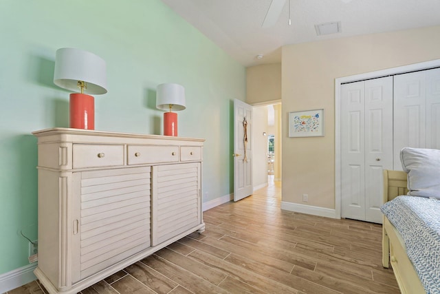 5885 SE Forest Glade Trl, Hobe Sound, FL 33455 - bedroom with light wood-type flooring and a closet