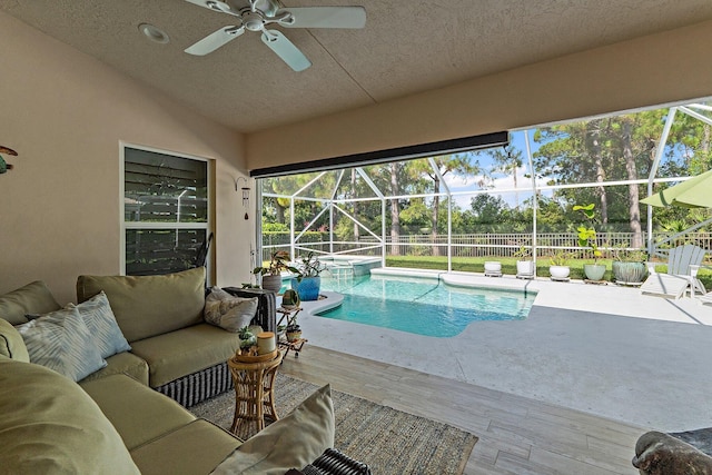5885 SE Forest Glade Trl, Hobe Sound, FL 33455 - view of swimming pool featuring a patio area, ceiling fan, an outdoor living space, and a pool with connected hot tub