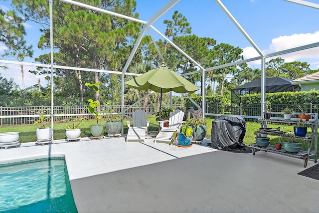 5885 SE Forest Glade Trl, Hobe Sound, FL 33455 - view of swimming pool featuring a fenced backyard, a patio area, a grill, and glass enclosure