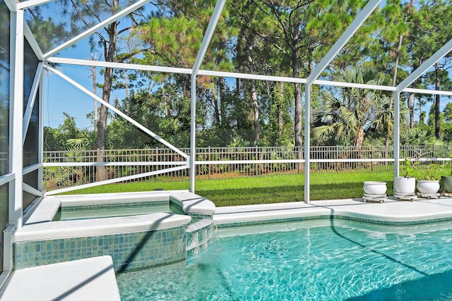 5885 SE Forest Glade Trl, Hobe Sound, FL 33455 - view of swimming pool featuring a fenced backyard, a lanai, a patio, and a pool with connected hot tub
