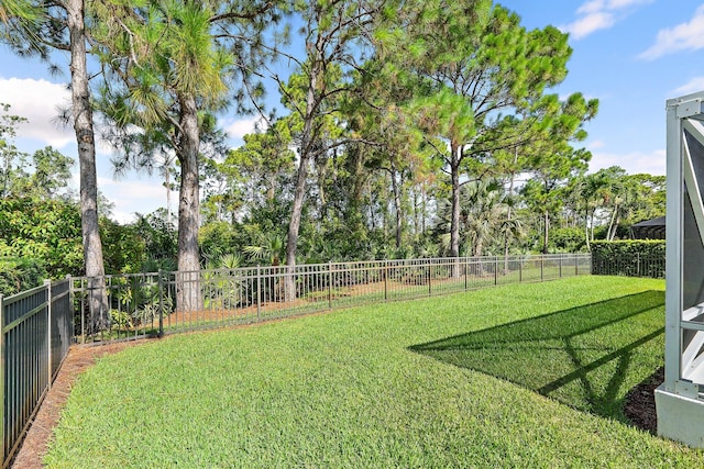 5885 SE Forest Glade Trl, Hobe Sound, FL 33455 - fenced backyard with view of scattered trees