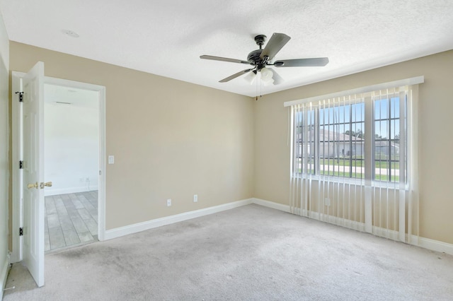 1669 SE N Blackwell Dr, Port Saint Lucie, FL 34952 - carpeted spare room with a ceiling fan and a textured ceiling
