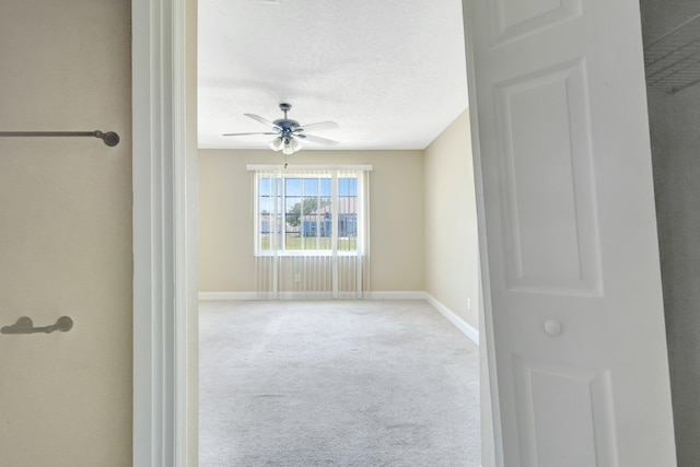 1669 SE N Blackwell Dr, Port Saint Lucie, FL 34952 - unfurnished room featuring a ceiling fan, carpet floors, and a textured ceiling