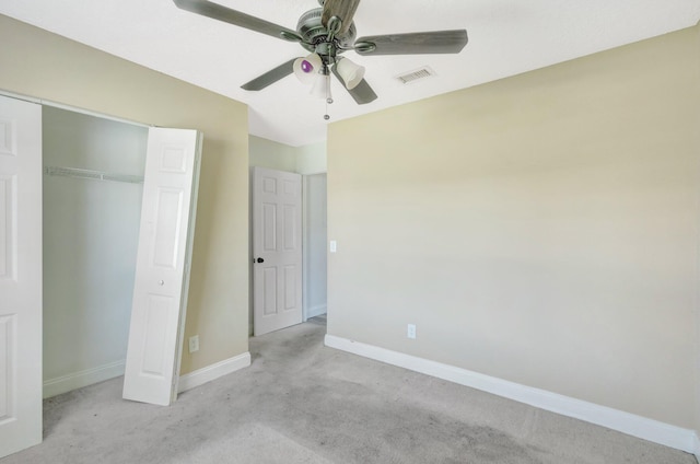 1669 SE N Blackwell Dr, Port Saint Lucie, FL 34952 - unfurnished bedroom featuring light carpet, a closet, and a ceiling fan