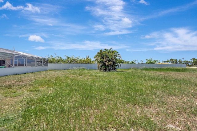 1669 SE N Blackwell Dr, Port Saint Lucie, FL 34952 - view of yard with a lanai