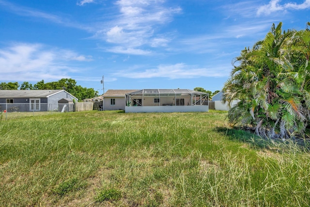 1669 SE N Blackwell Dr, Port Saint Lucie, FL 34952 - rear view of property with a lanai