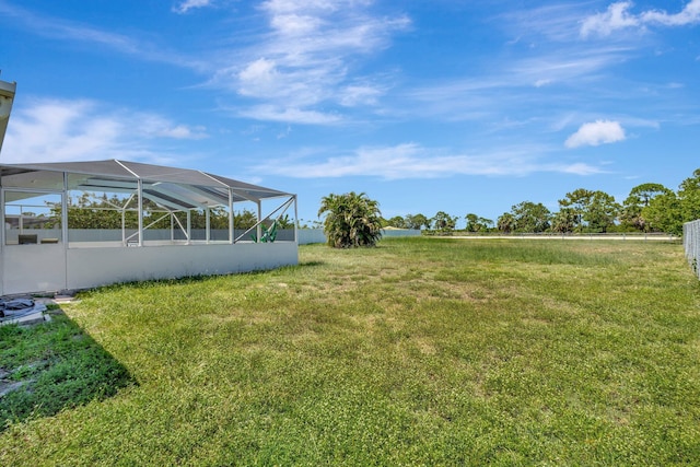 1669 SE N Blackwell Dr, Port Saint Lucie, FL 34952 - view of green lawn featuring glass enclosure