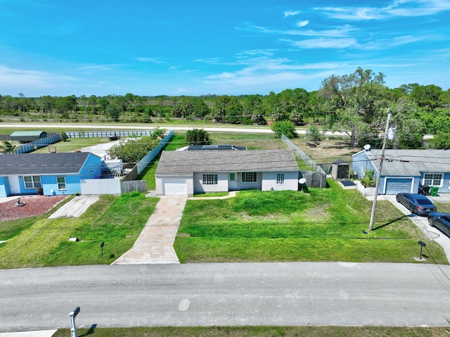 1669 SE N Blackwell Dr, Port Saint Lucie, FL 34952 - view of subject property with a tree filled landscape