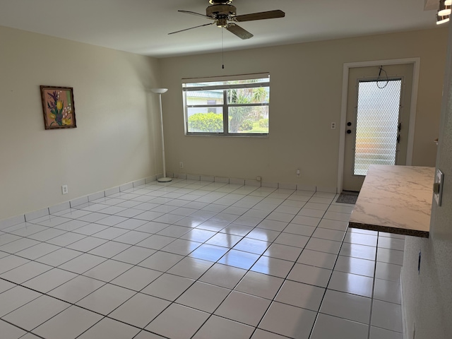64 Waterford C, Delray Beach, FL 33446 - unfurnished room with ceiling fan and light tile patterned floors