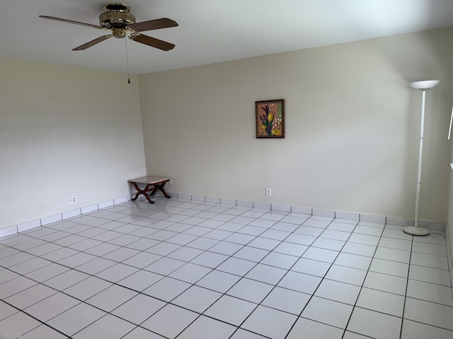 64 Waterford C, Delray Beach, FL 33446 - empty room featuring a ceiling fan and light tile patterned floors