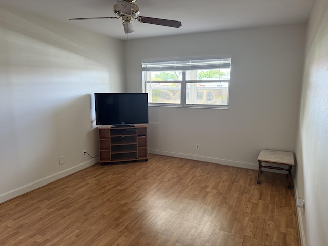 64 Waterford C, Delray Beach, FL 33446 - empty room with wood finished floors and ceiling fan