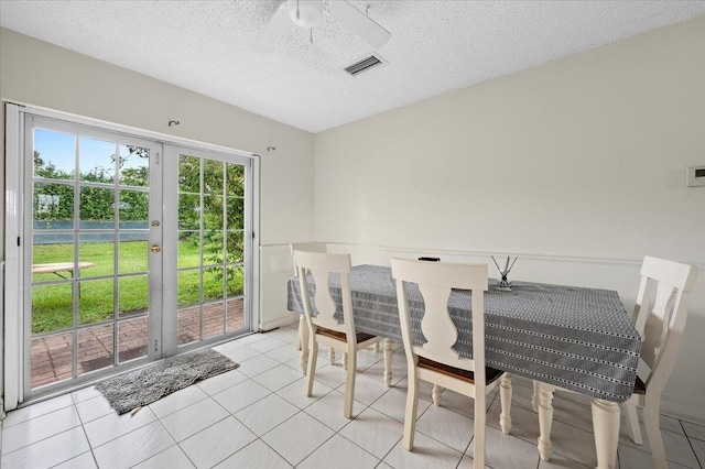 19309 Carolina Cir, Boca Raton, FL 33434 - dining space featuring a ceiling fan, a textured ceiling, and light tile patterned floors