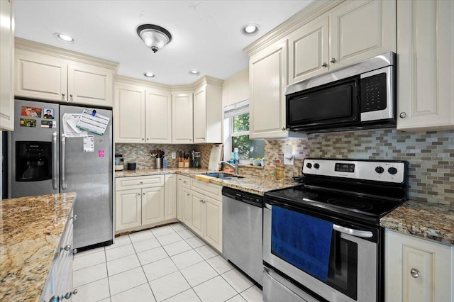 19309 Carolina Cir, Boca Raton, FL 33434 - kitchen with stainless steel appliances, light tile patterned floors, backsplash, light stone countertops, and recessed lighting