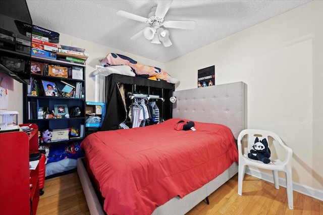 19309 Carolina Cir, Boca Raton, FL 33434 - bedroom with a textured ceiling, wood finished floors, and a ceiling fan