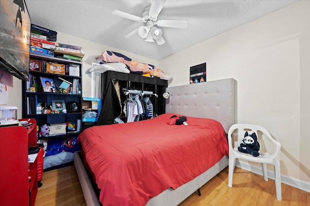 19309 Carolina Cir, Boca Raton, FL 33434 - bedroom with a textured ceiling, wood finished floors, and a ceiling fan
