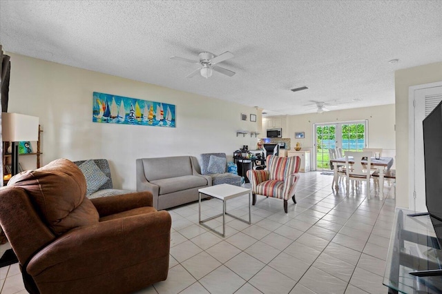19309 Carolina Cir, Boca Raton, FL 33434 - living area featuring a ceiling fan, a textured ceiling, and light tile patterned floors