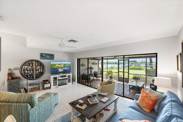 1102 SE Mitchell Ave Unit 302, Port Saint Lucie, FL 34952 - living area featuring light tile patterned floors and a ceiling fan
